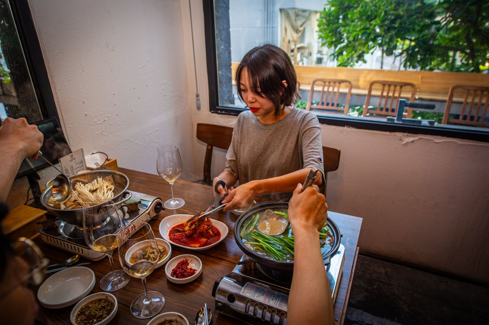Sharing a traditional Korean suyuk hotpot with homemade kimchi at Minjeong Restaurant in Seongsu, enjoying an authentic local dining experience.